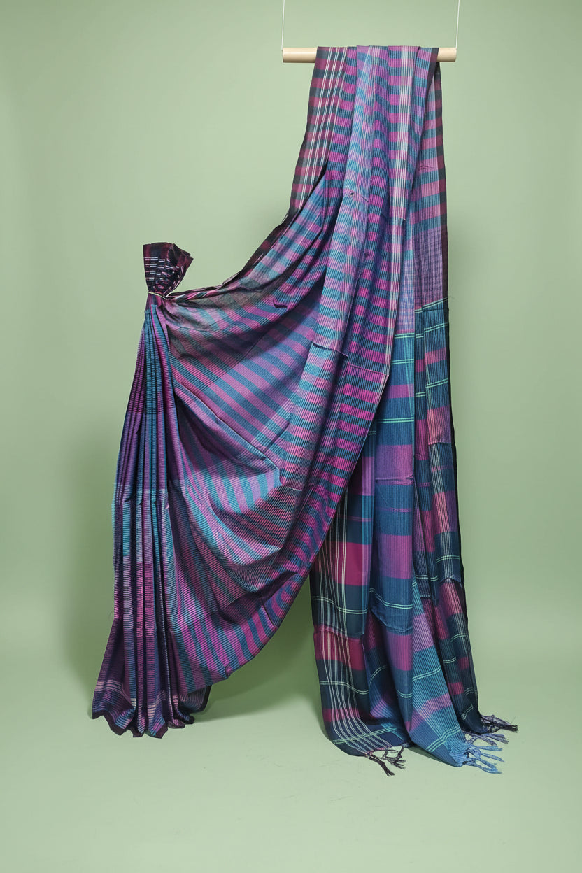Purple and blue checkered saree draped over a white background