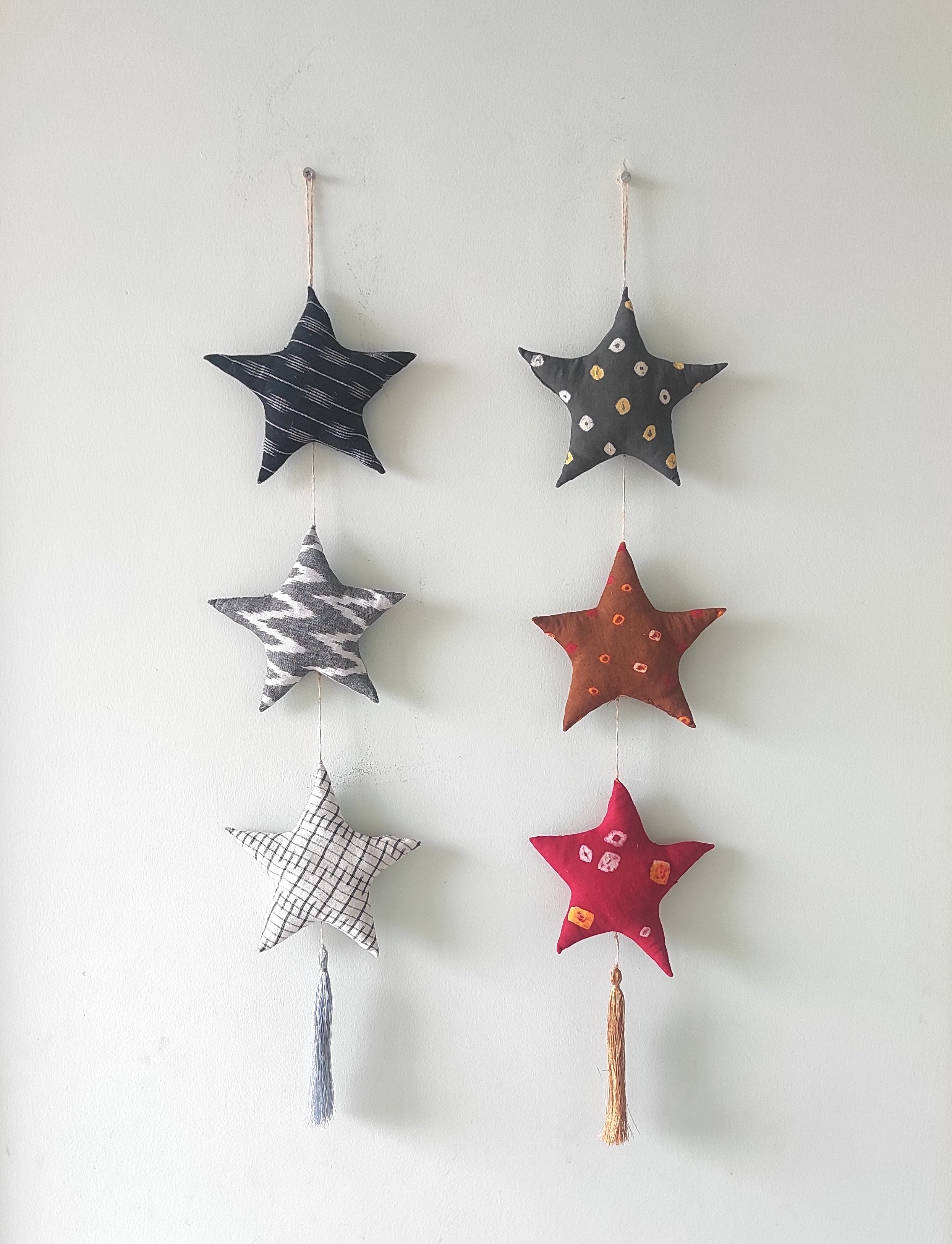 3 Stuffed Fabric Stars in 3 Colors hang together, filled only with organic materials