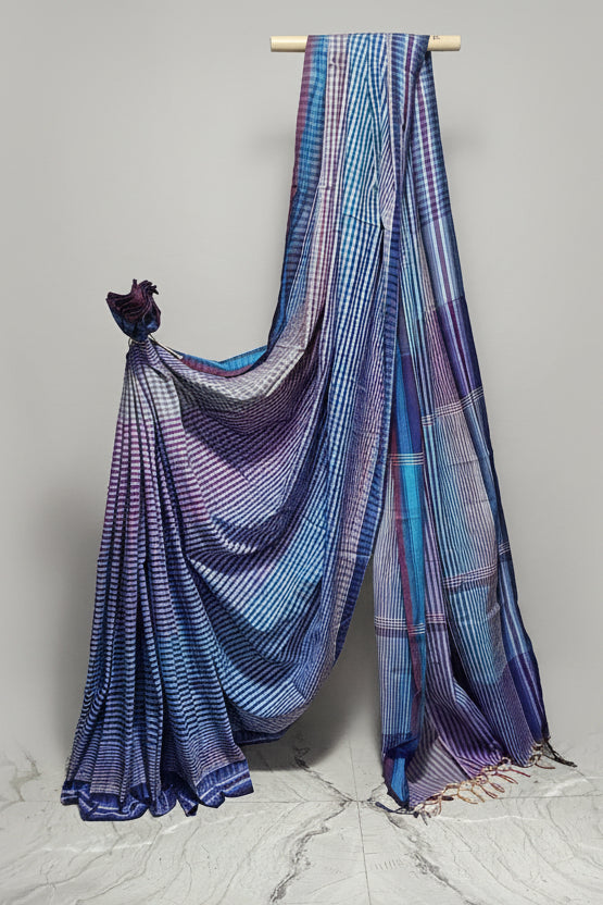 Blue and purple checkered Saree draped over a white background