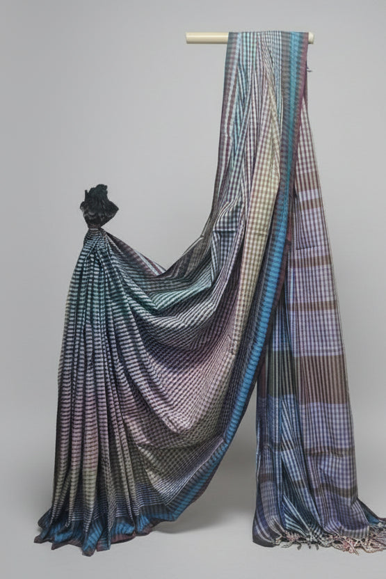 Multicolored checkered saree draped over a mannequin against a plain background