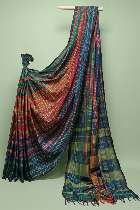 Multicolored plaid saree draped over a white background