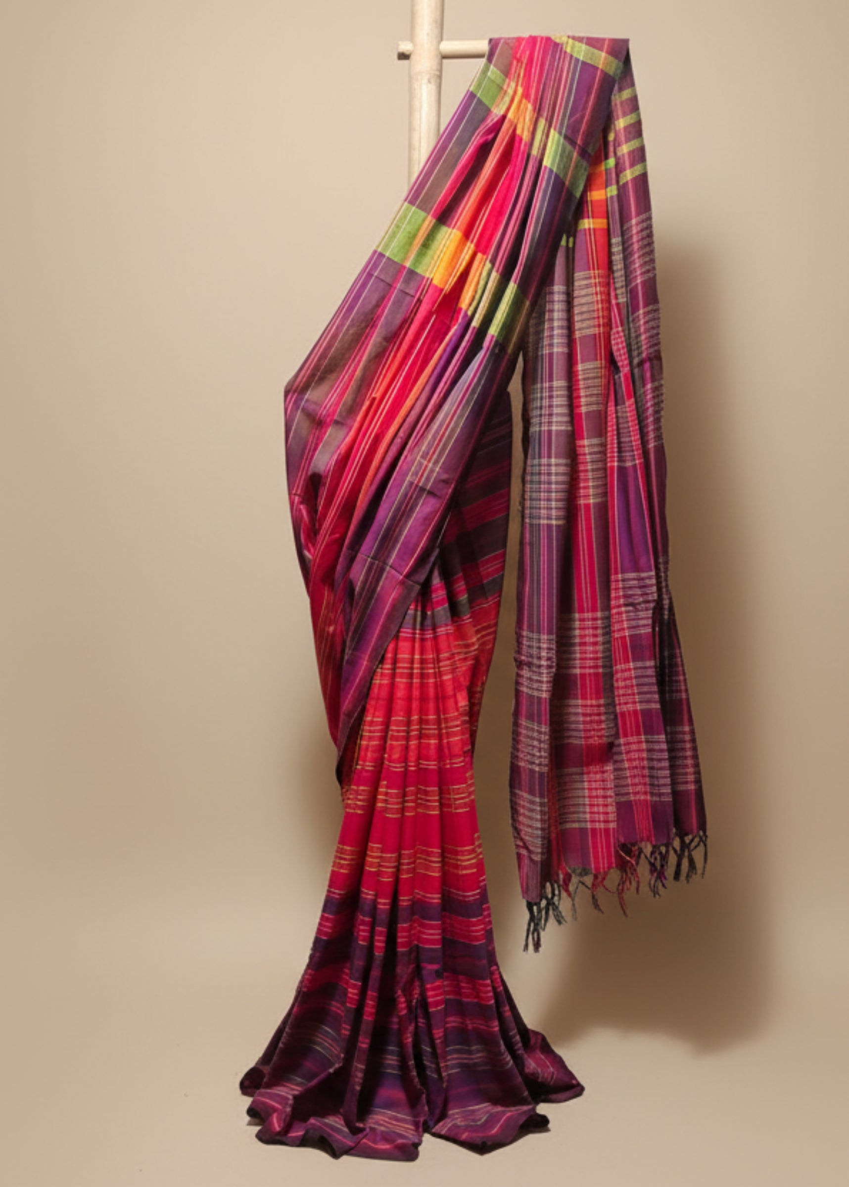 Colorful plaid fabric draped over a white background