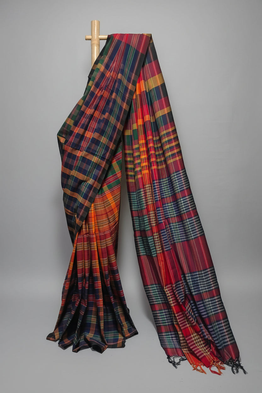 Plaid patterned fabric draped over a wooden rod against a white background