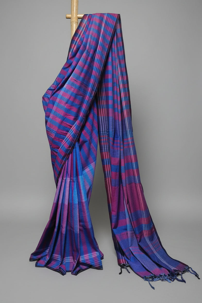 Blue and purple striped saree on a white background